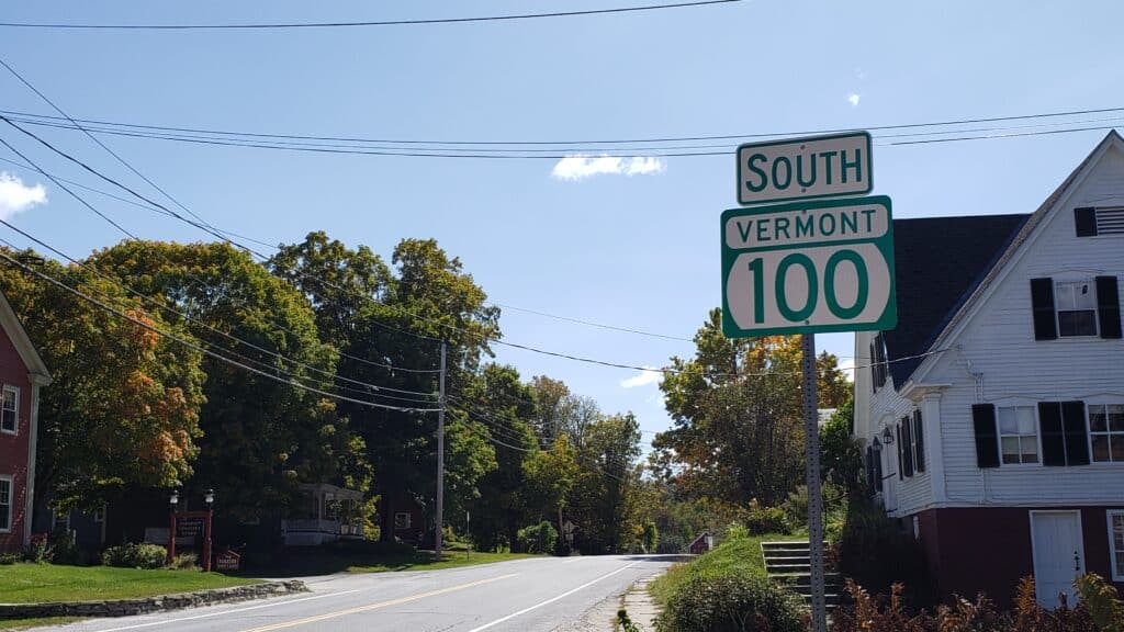 A close up of the South Vermont 100 sign on a scenic byway in Vermont