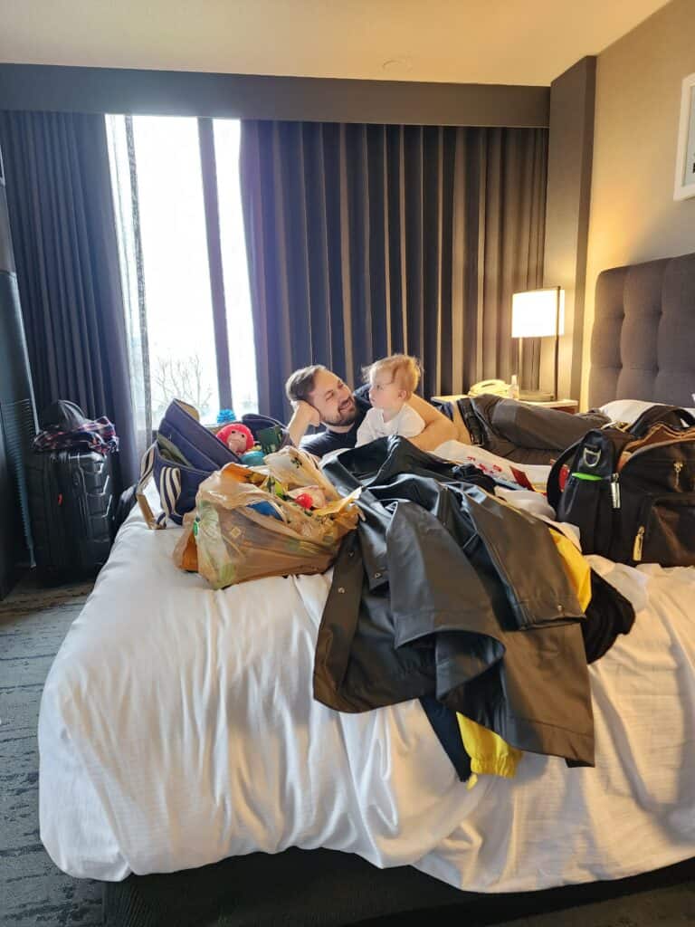 A father and toddler hang out in a hotel room in Burlington, Vermont