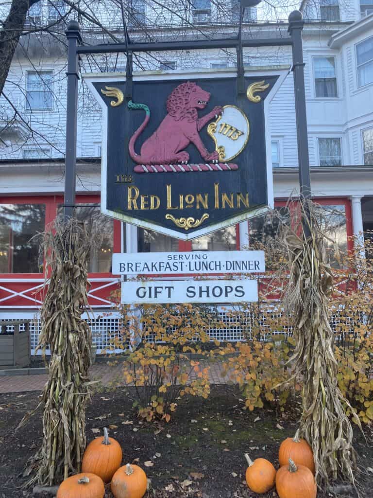 A close up of a sign for the Red Lion Inn, a historic inn in Stockbridge, Massachusetts, decorated for fall